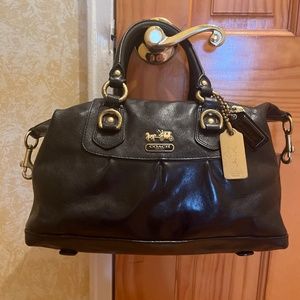 Coach Handbag, contains two hooks on each side to change look a bit,